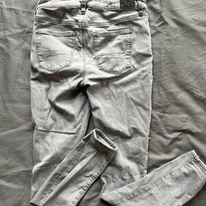 #22 AMERICAN EAGLE high rise distressed jegging size 6 light gray